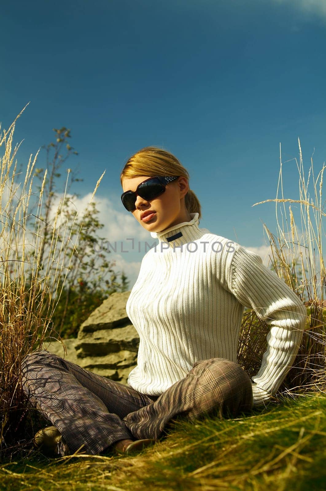 Young beautiful model posing in mountain outdoor scenery
