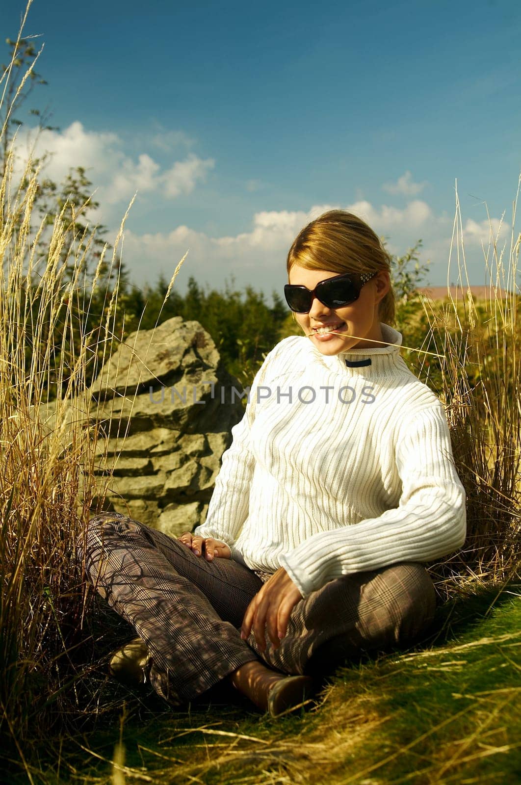 Young beautiful model posing in mountain outdoor scenery