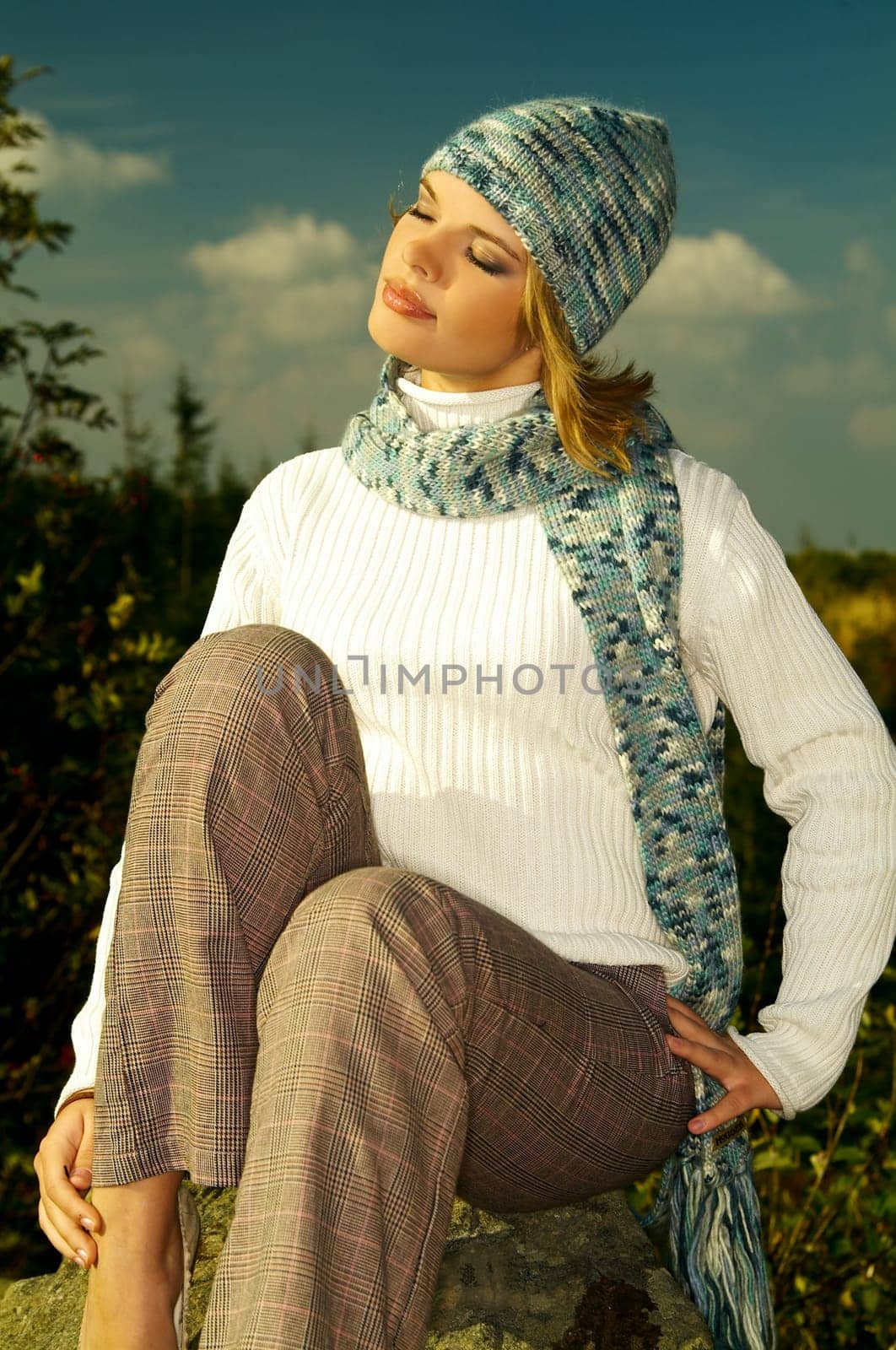 Young business woman relaxing in mountains outdoors