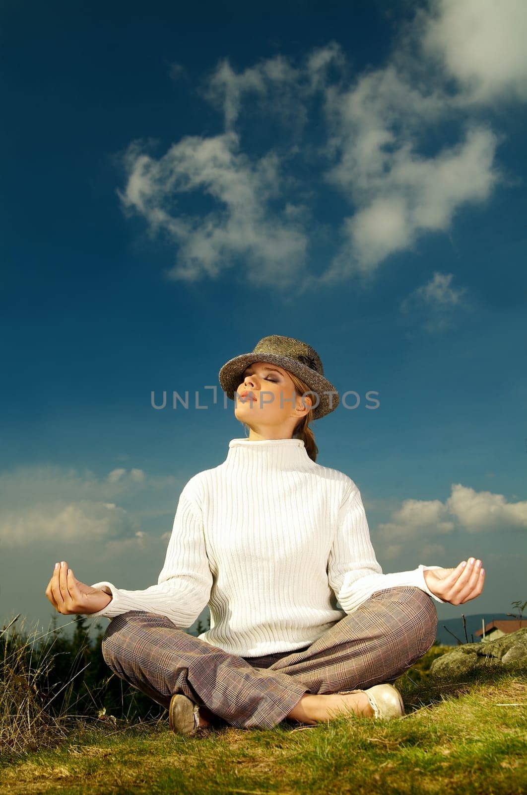 Young beautiful model posing in mountain outdoor scenery