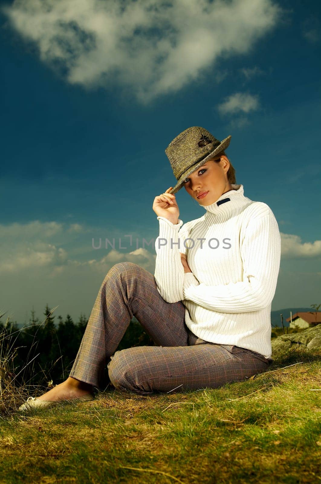 Young beautiful model posing in mountain outdoor scenery