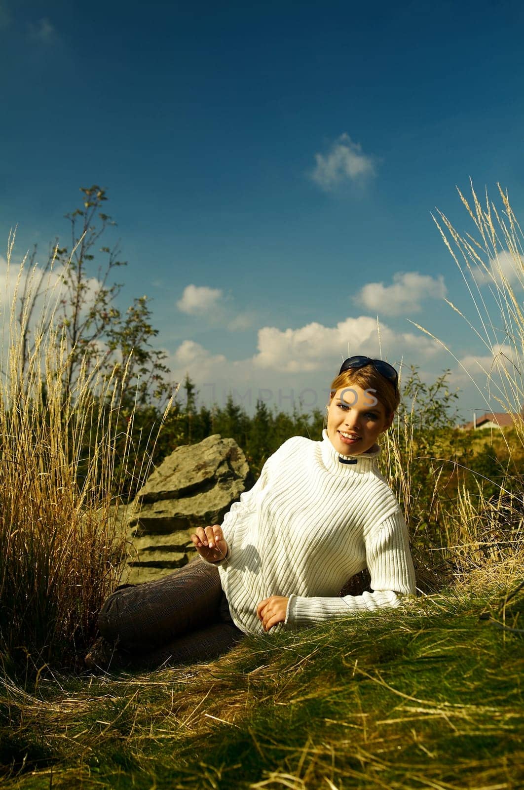 Young beautiful model posing in mountain outdoor scenery