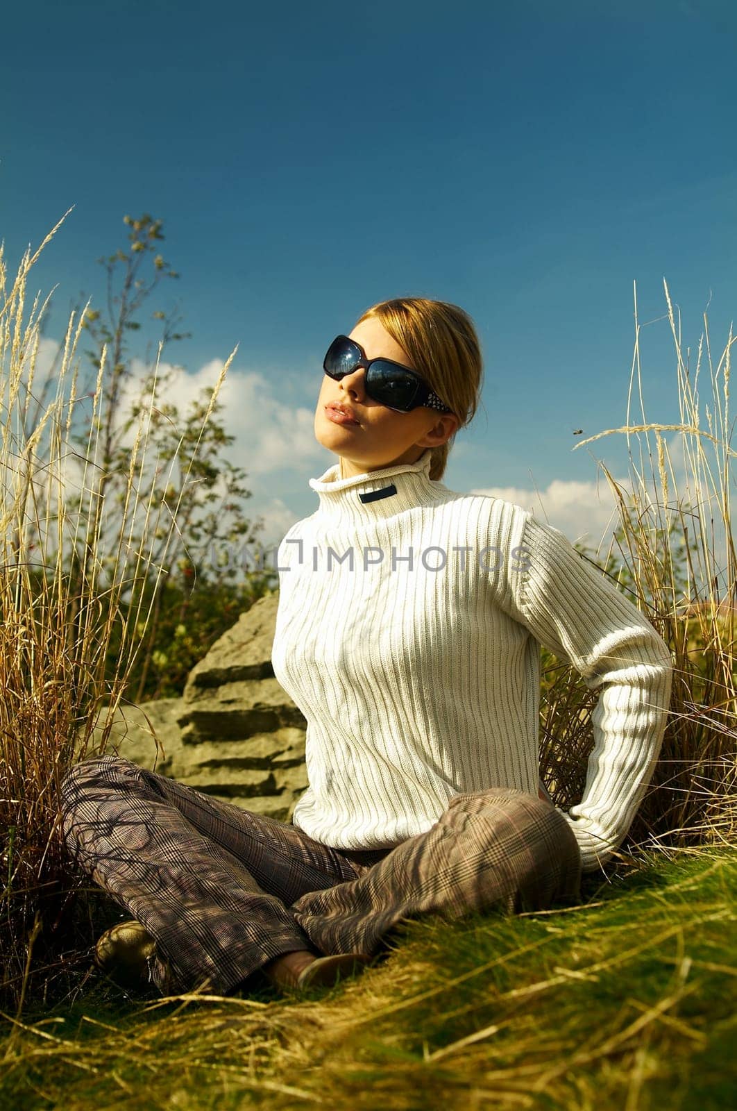 Young beautiful model posing in mountain outdoor scenery