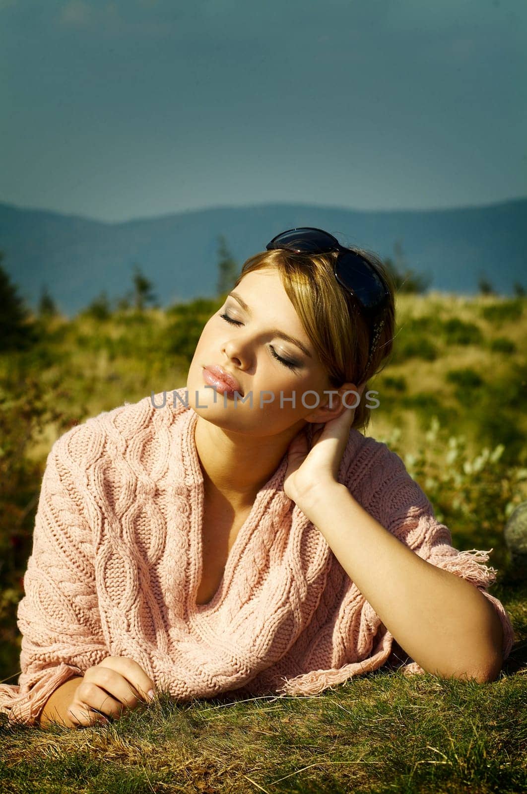 Young business woman relaxing on mountains outdoors
