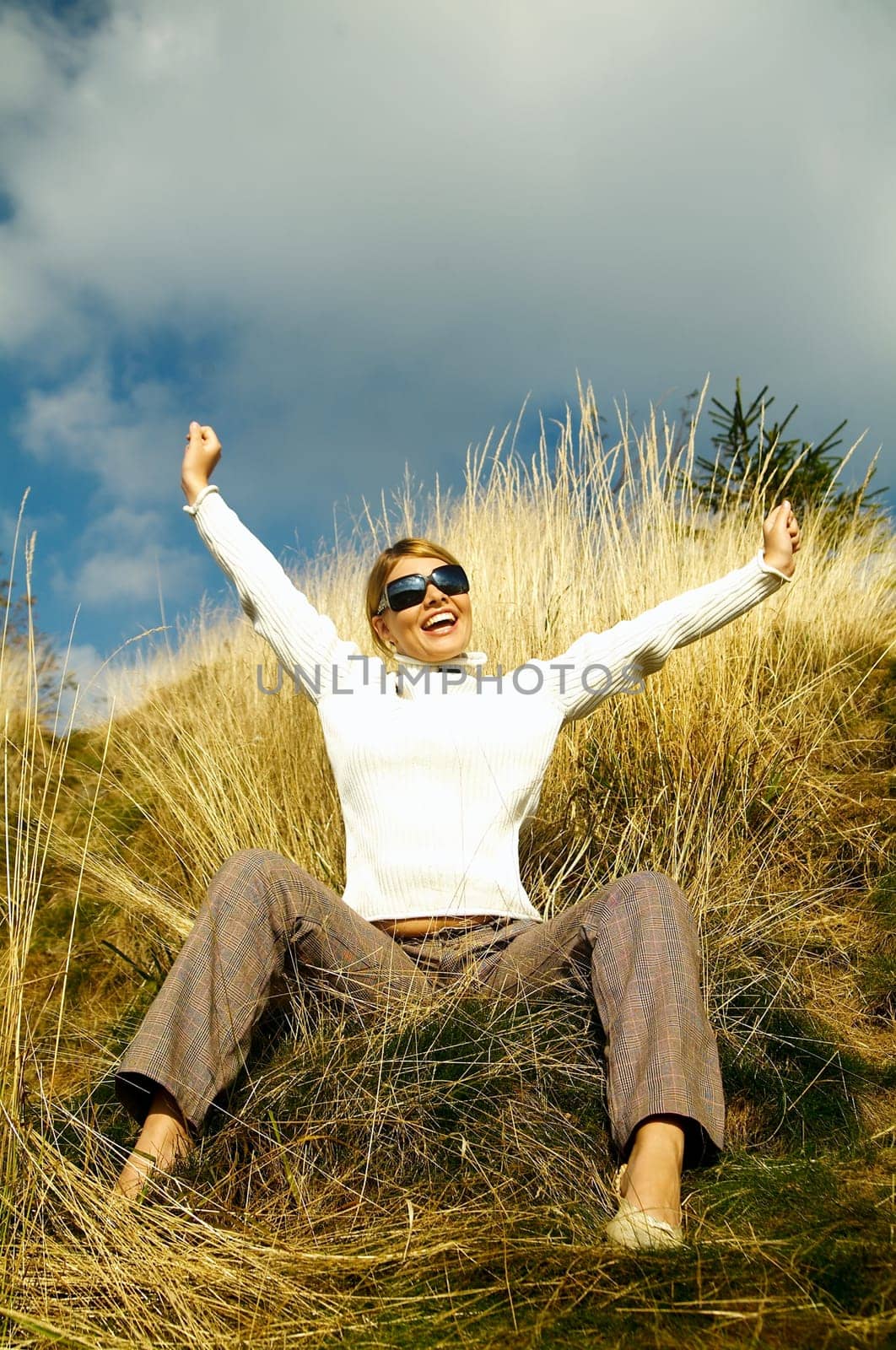 Young beautiful model posing in mountain outdoor scenery