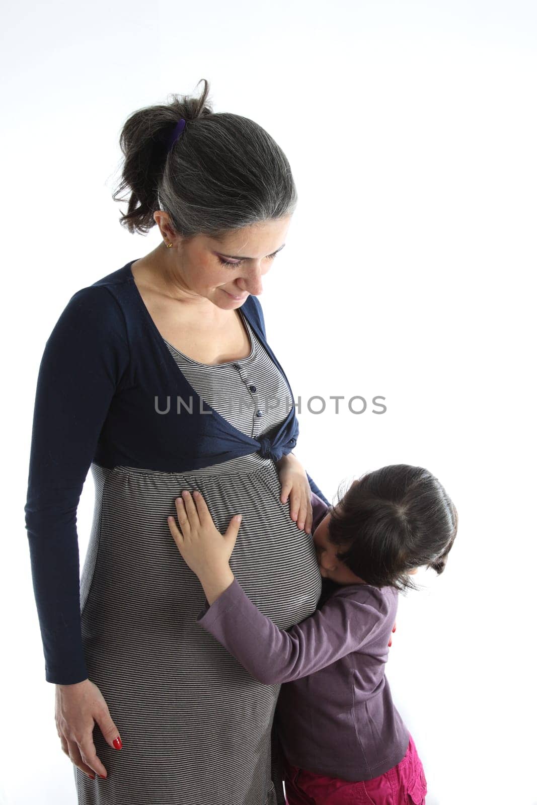 details of a Pregant woman with her daughter isolated on white