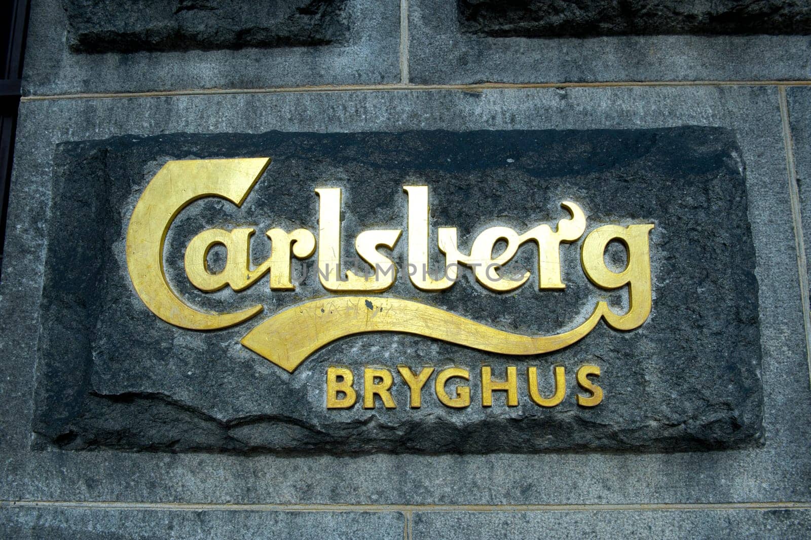 Sign on a facade of the main office of brewery Carlsberg in Copenhagen Denmark