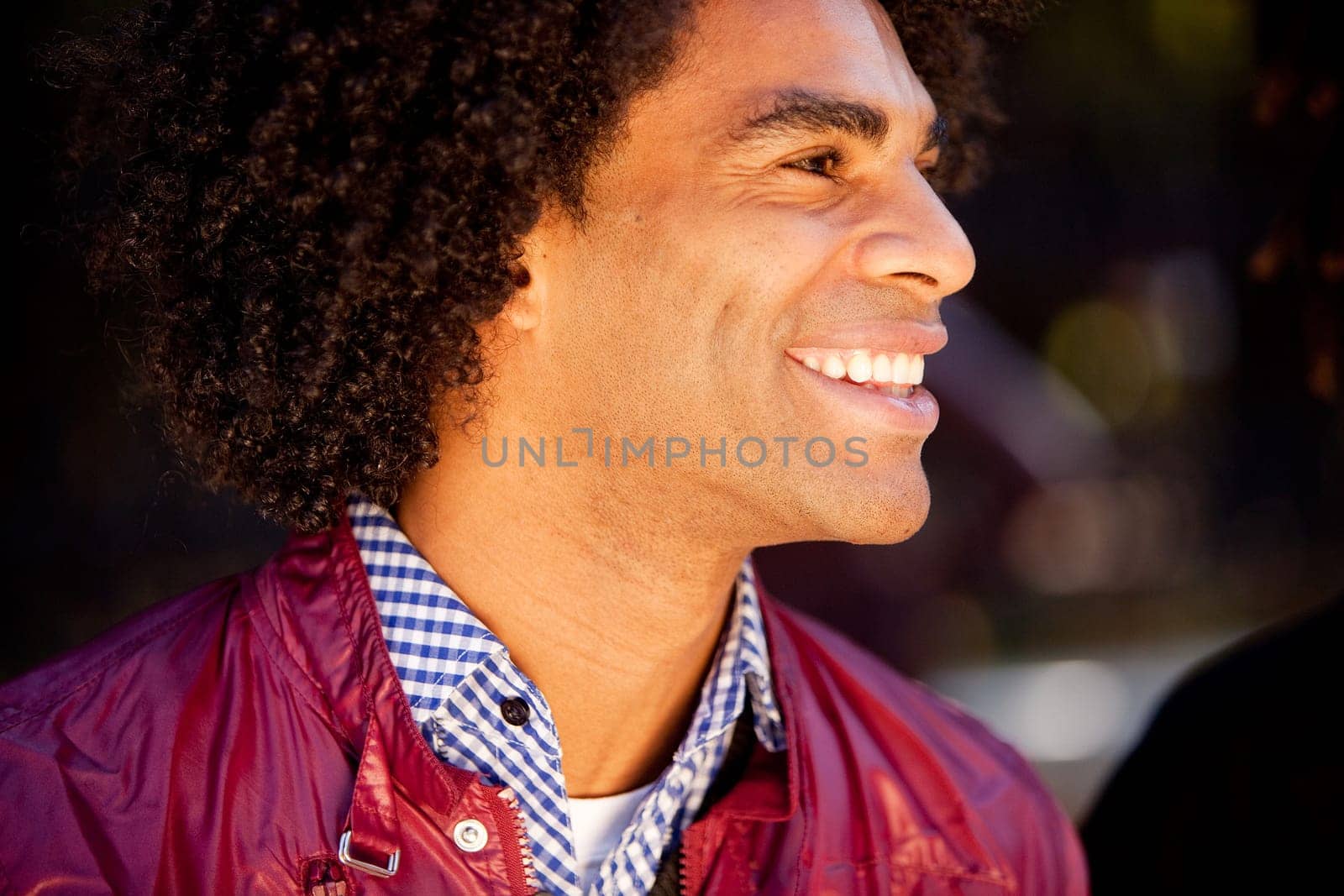 A candid portrait of a happy young man