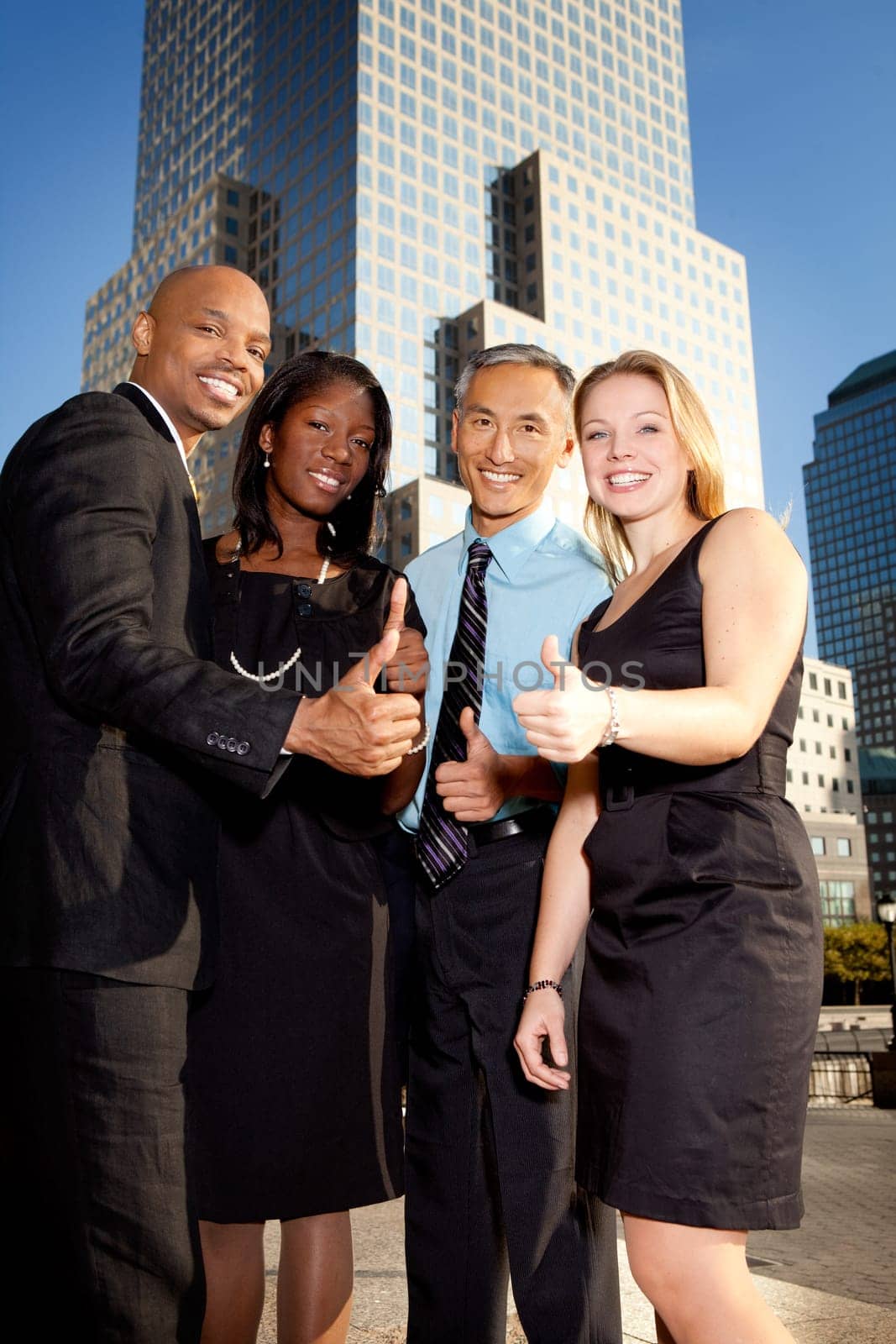 A business team giving a thumbs up