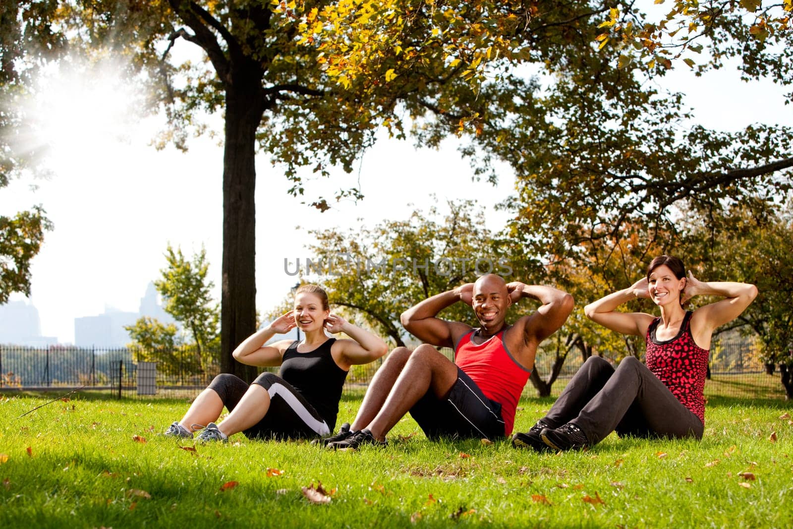 A group of people doing exercises in the park