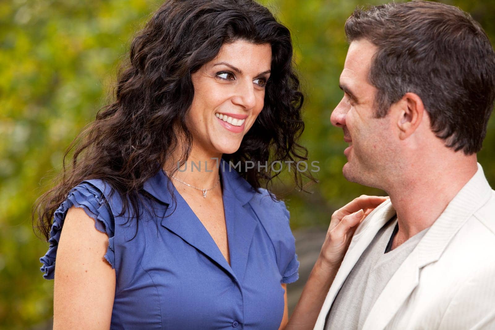 A woman looking happy at her husband / boyfriend - Focus on the woman