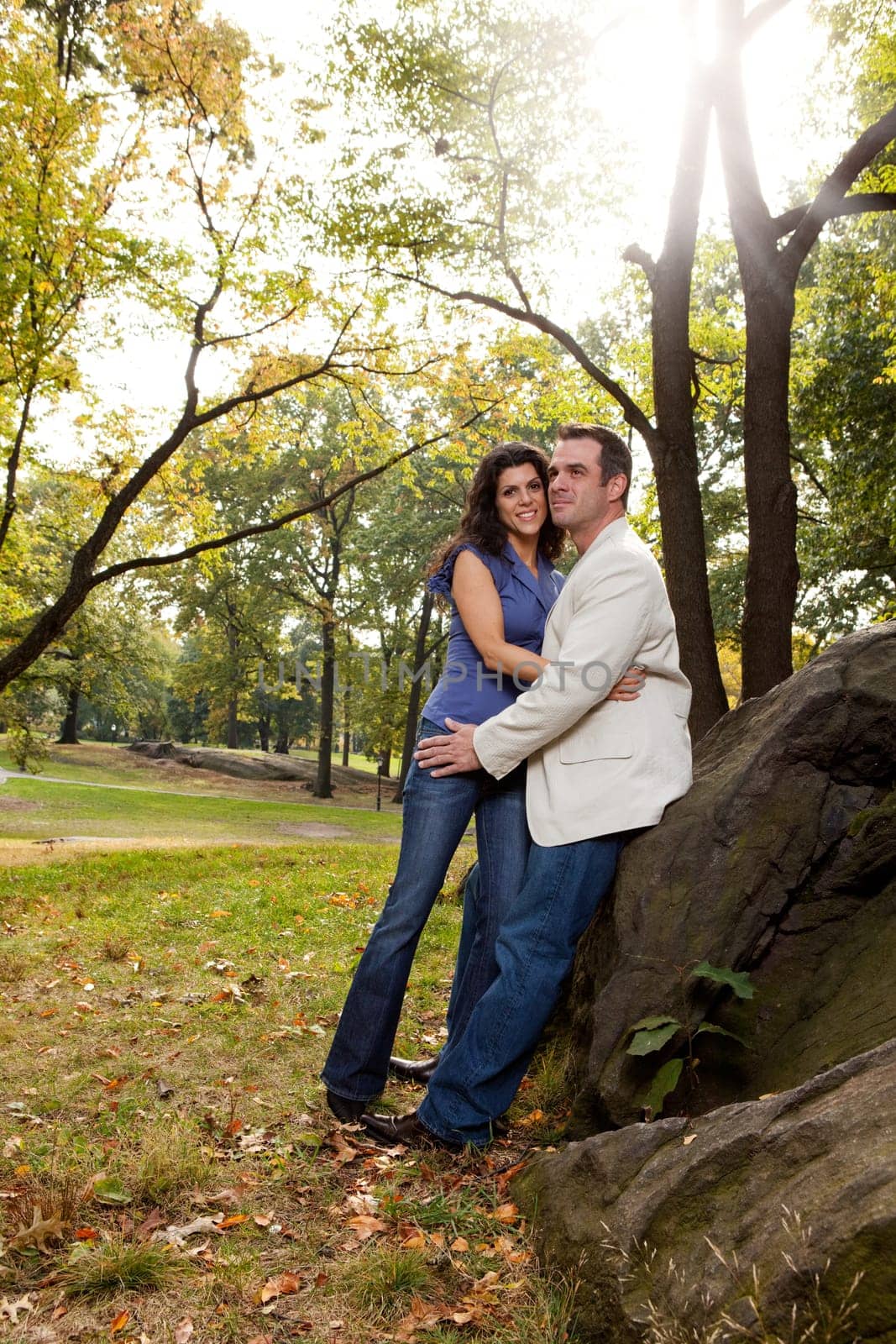 A happy couple relaxing in the park