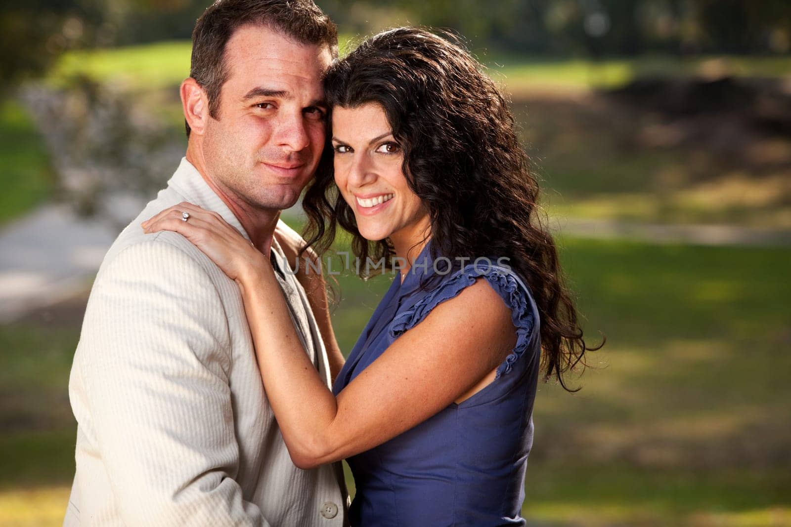 A couple posing for an engagement portrait
