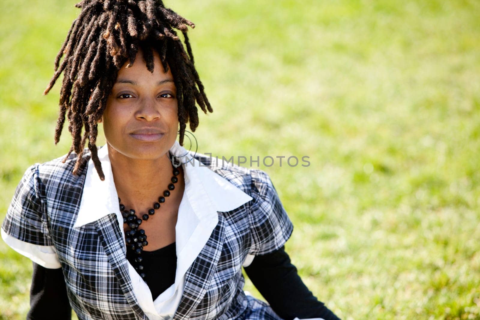 Young female model in outdoor setting. Horizontally framed shot.