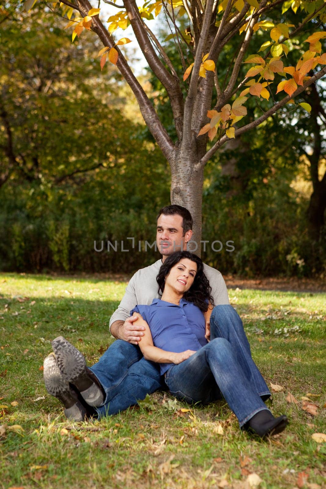 A couple relaxing, enjoying nature in a park