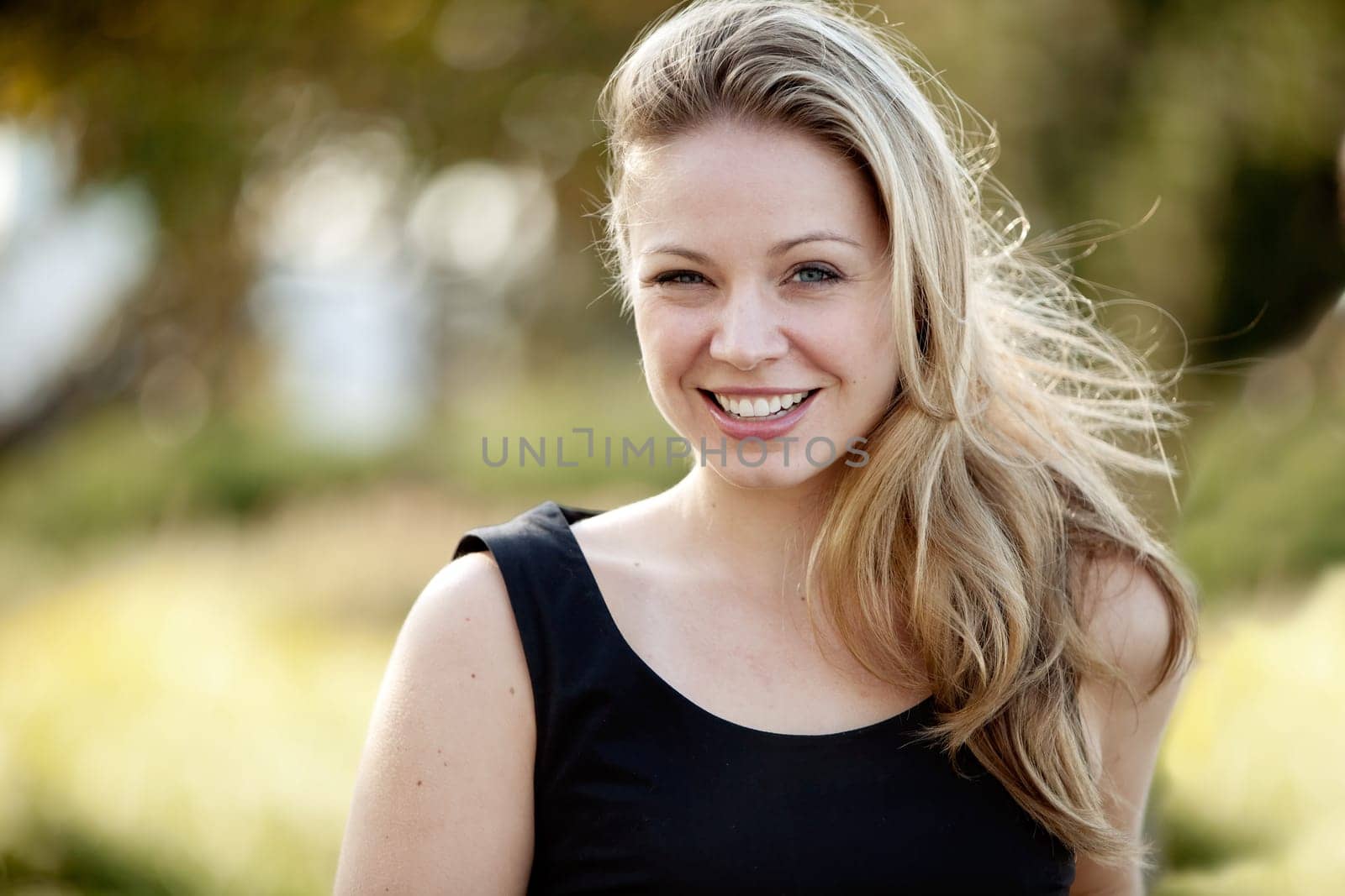 Young adult female model in outdoor setting. Horizontally framed shot.