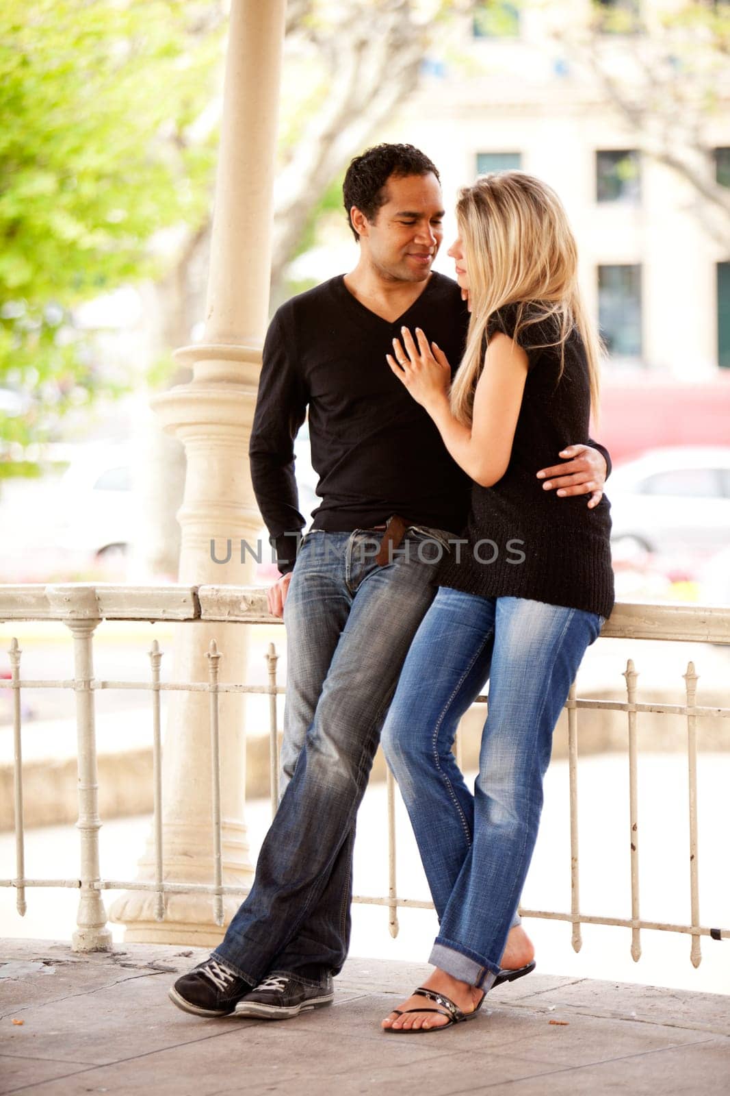A happy couple on vaction in an urban setting