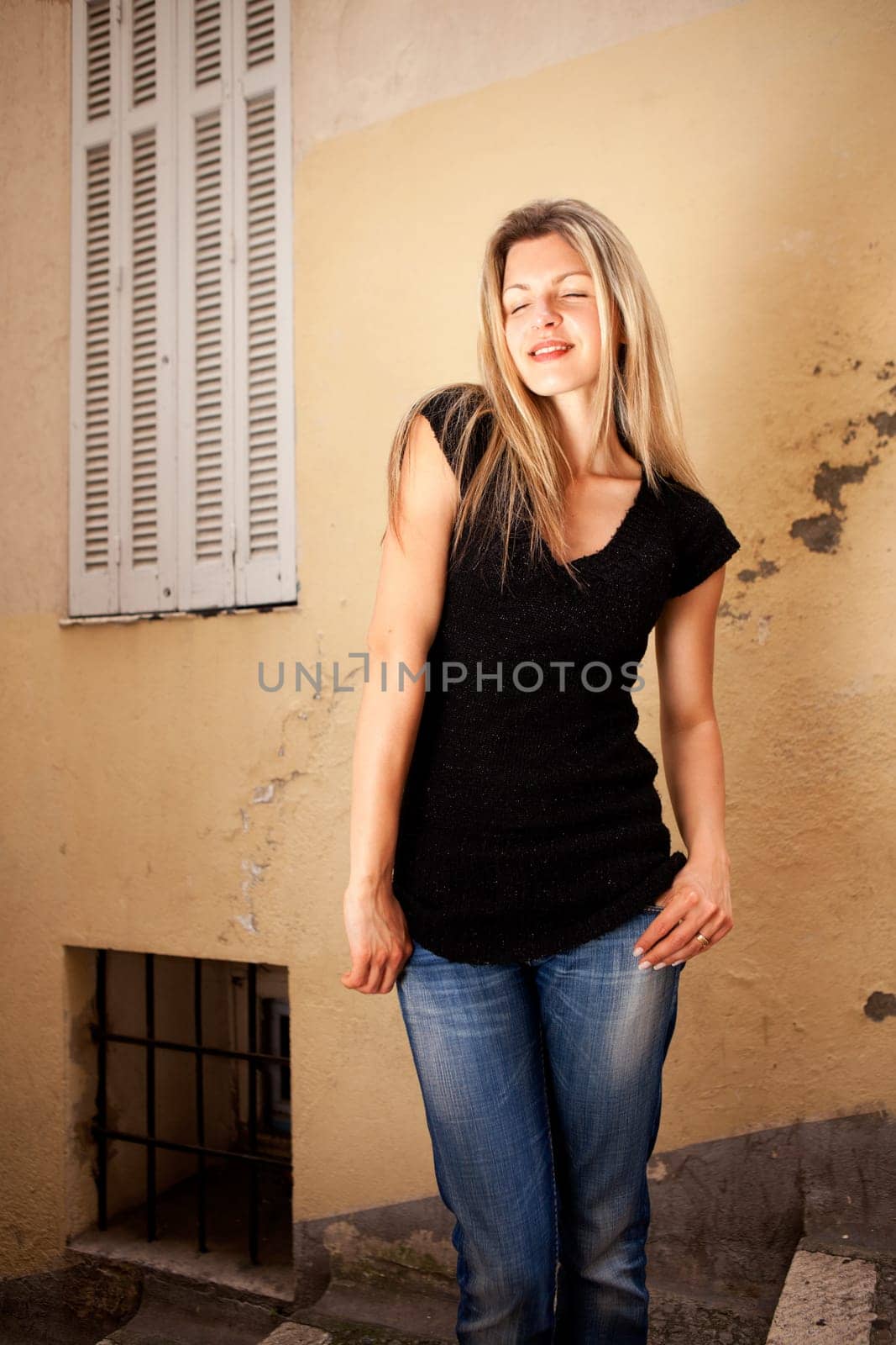 A pretty woman in an outdoor setting thinking and dreaming