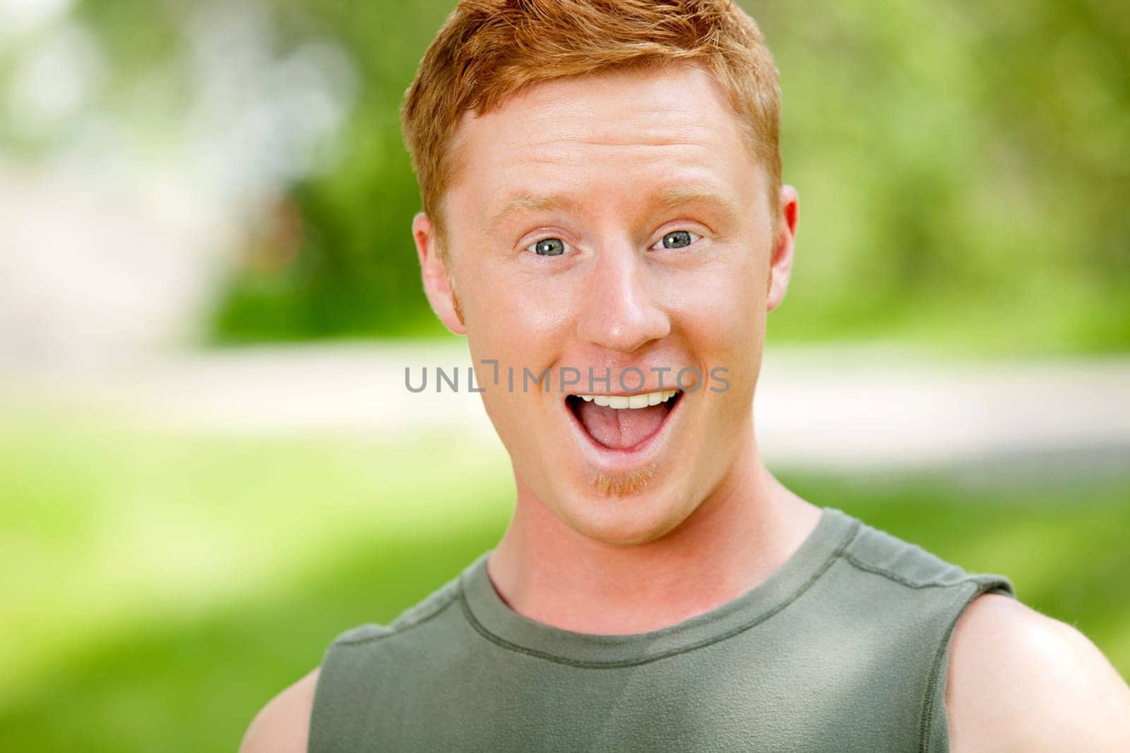 Excited man with mouth open against blur background