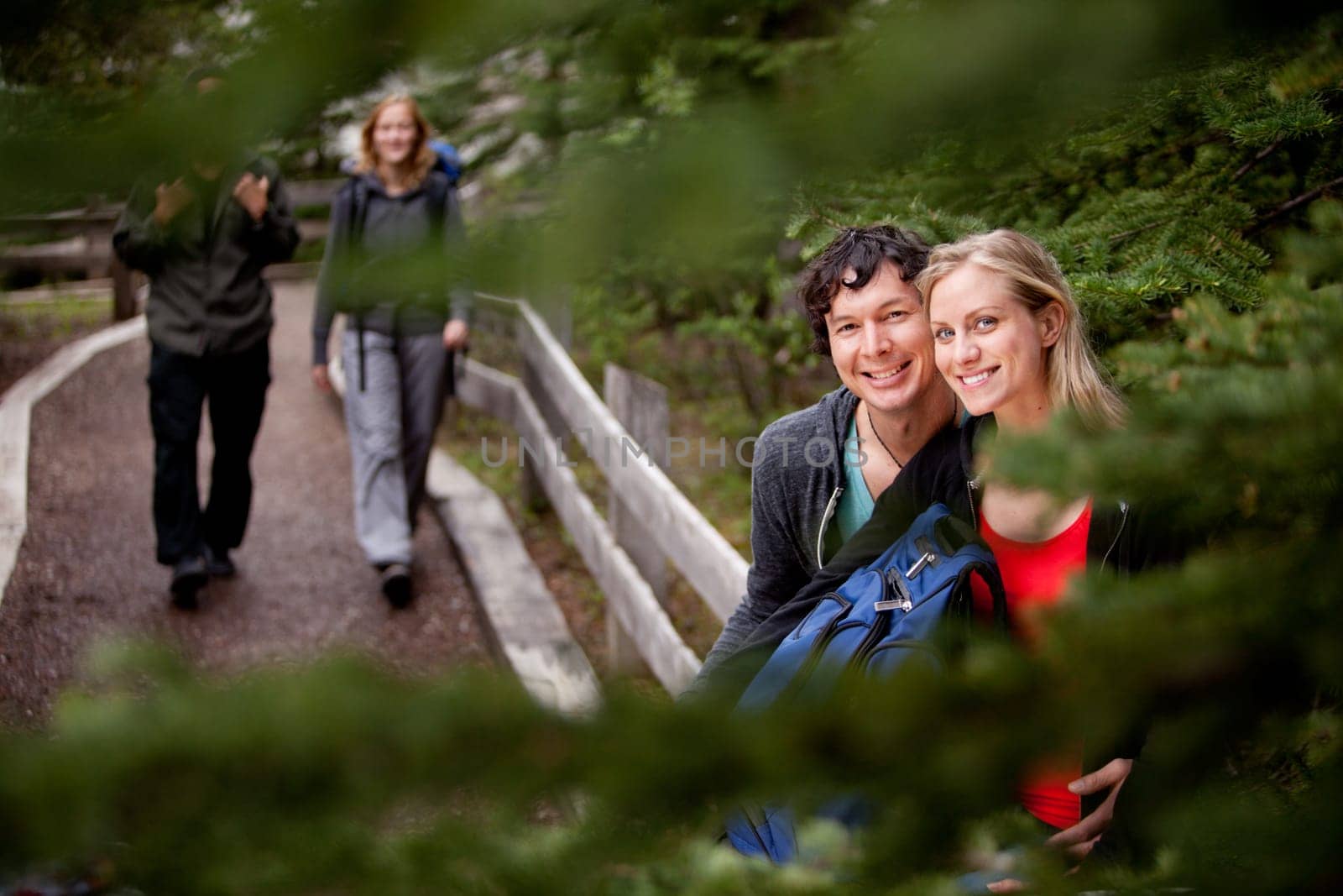 A happy couple on a forest trail