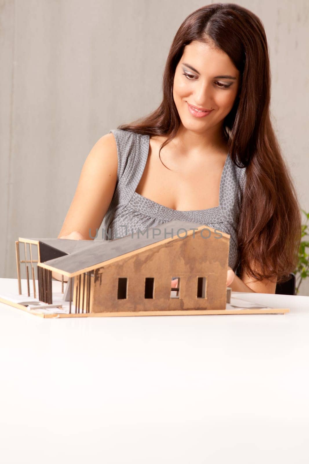 A female architect building a rough house study model