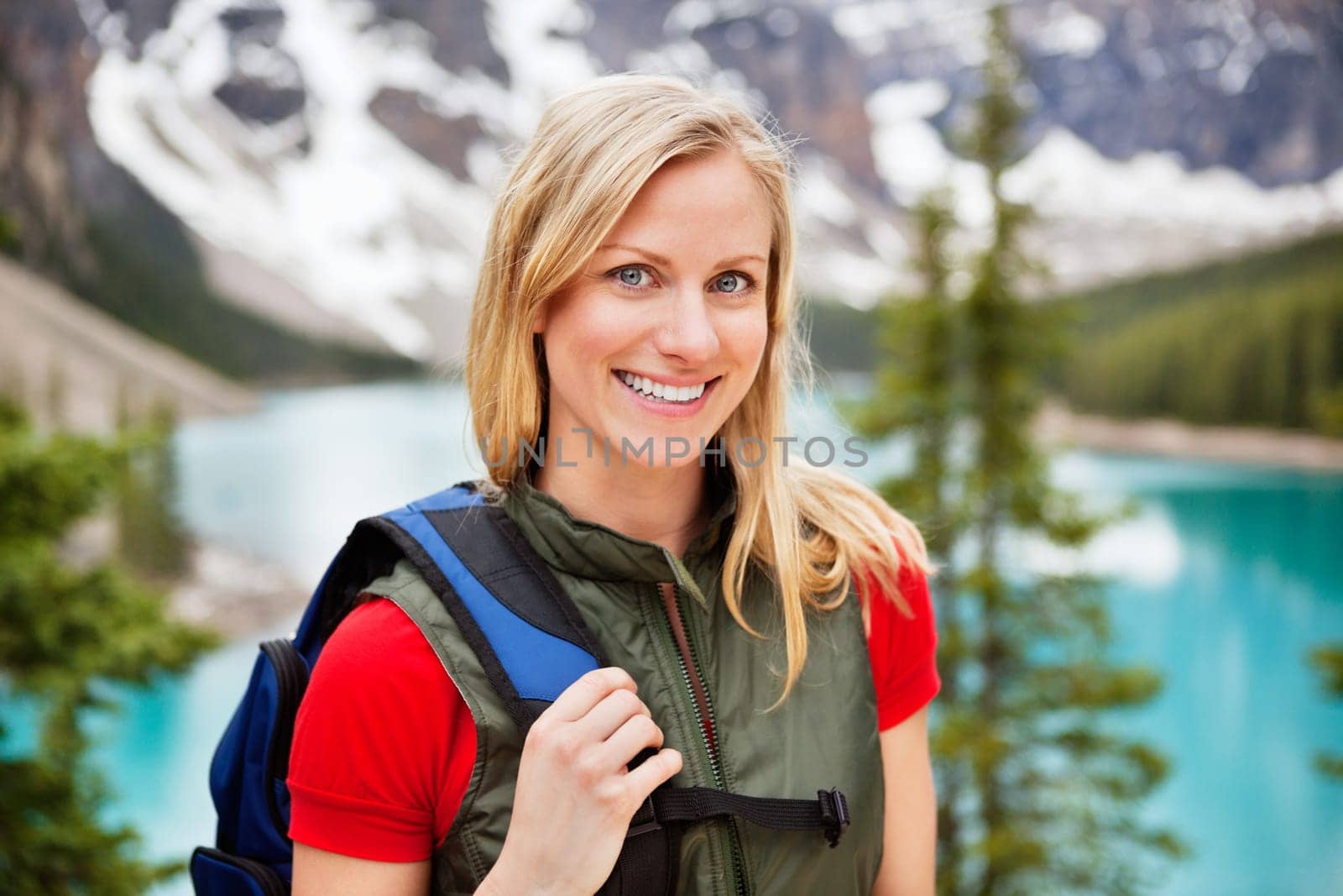 Portrait of happy beautiful female hiker smiling