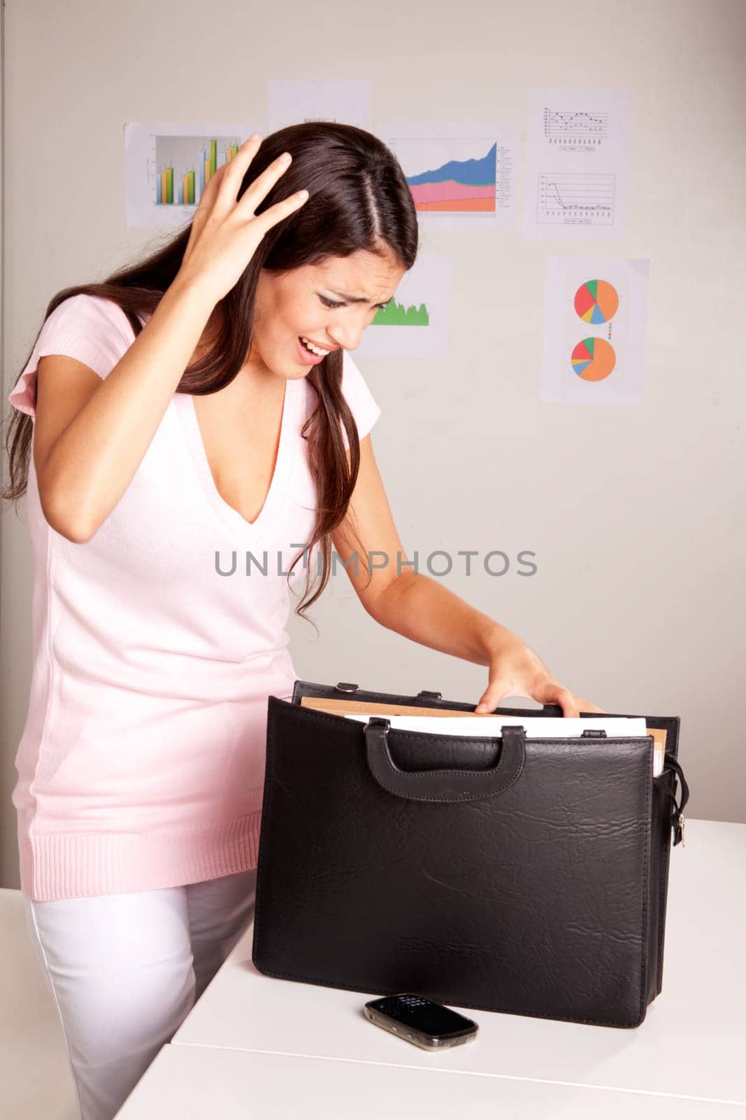 A stressed women who is looking for a lost document