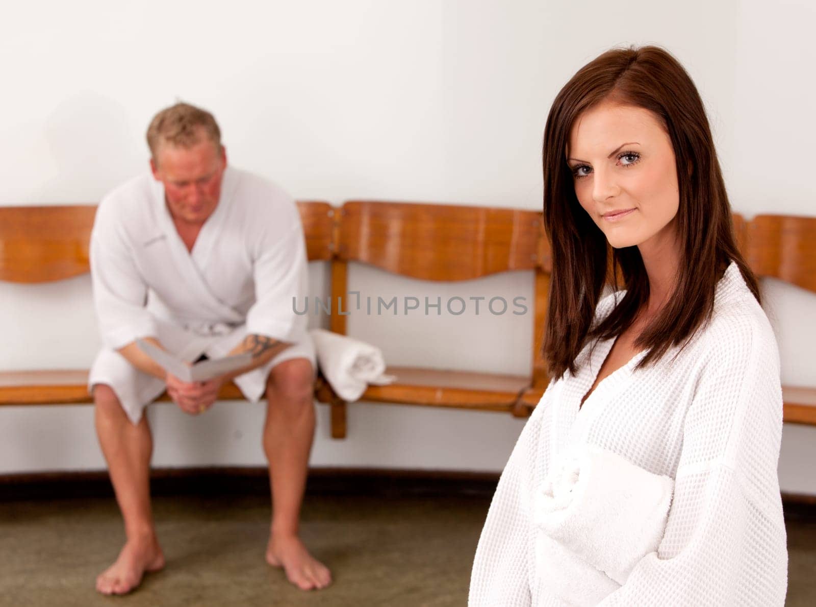 A man and woman in a waiting room at a spa