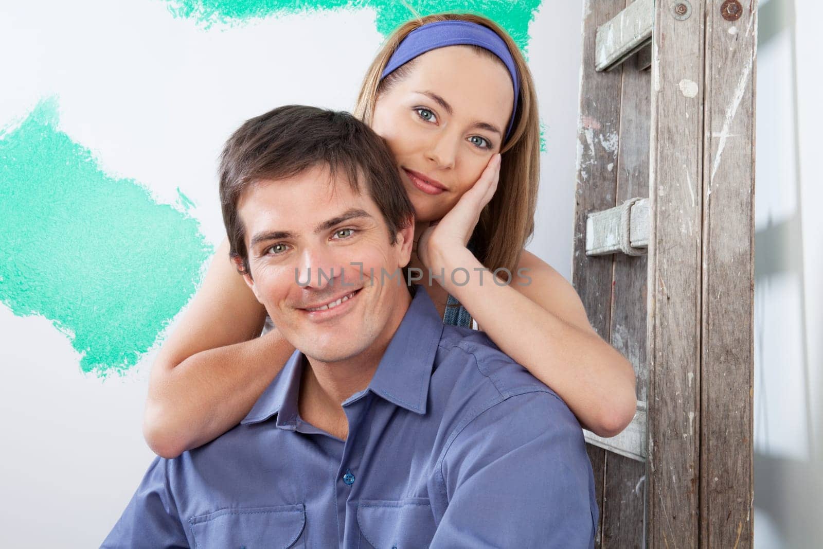 Portrait of a loving, young couple at their new apartment