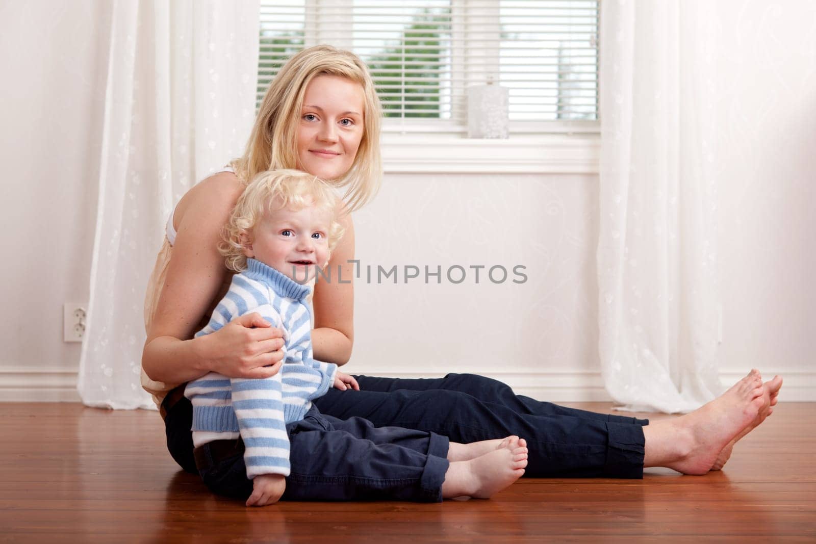 Portrait of a mother and son sitting in the living room