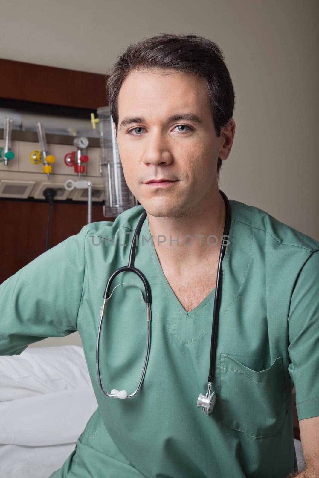 Portrait of young male doctor in hospital