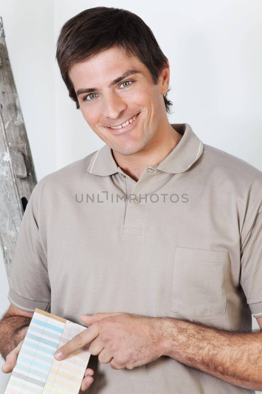 Portrait of a young man showing color guide