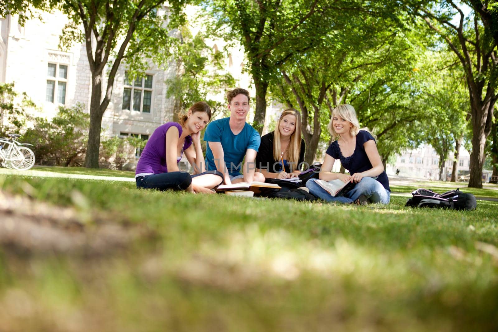 Happy group of university students looking at the camera