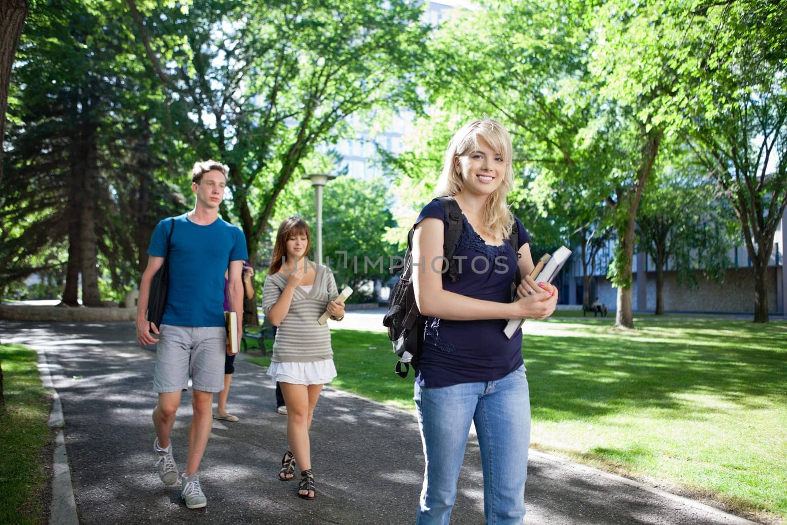 Group of students on their way to class walking through campus