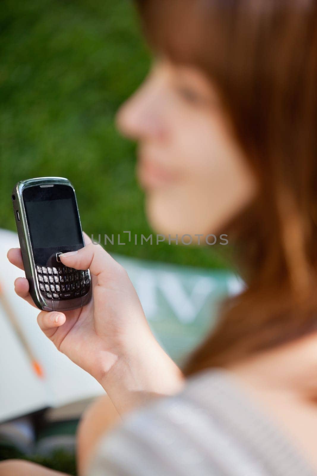 Close-up of young girl using cell phone