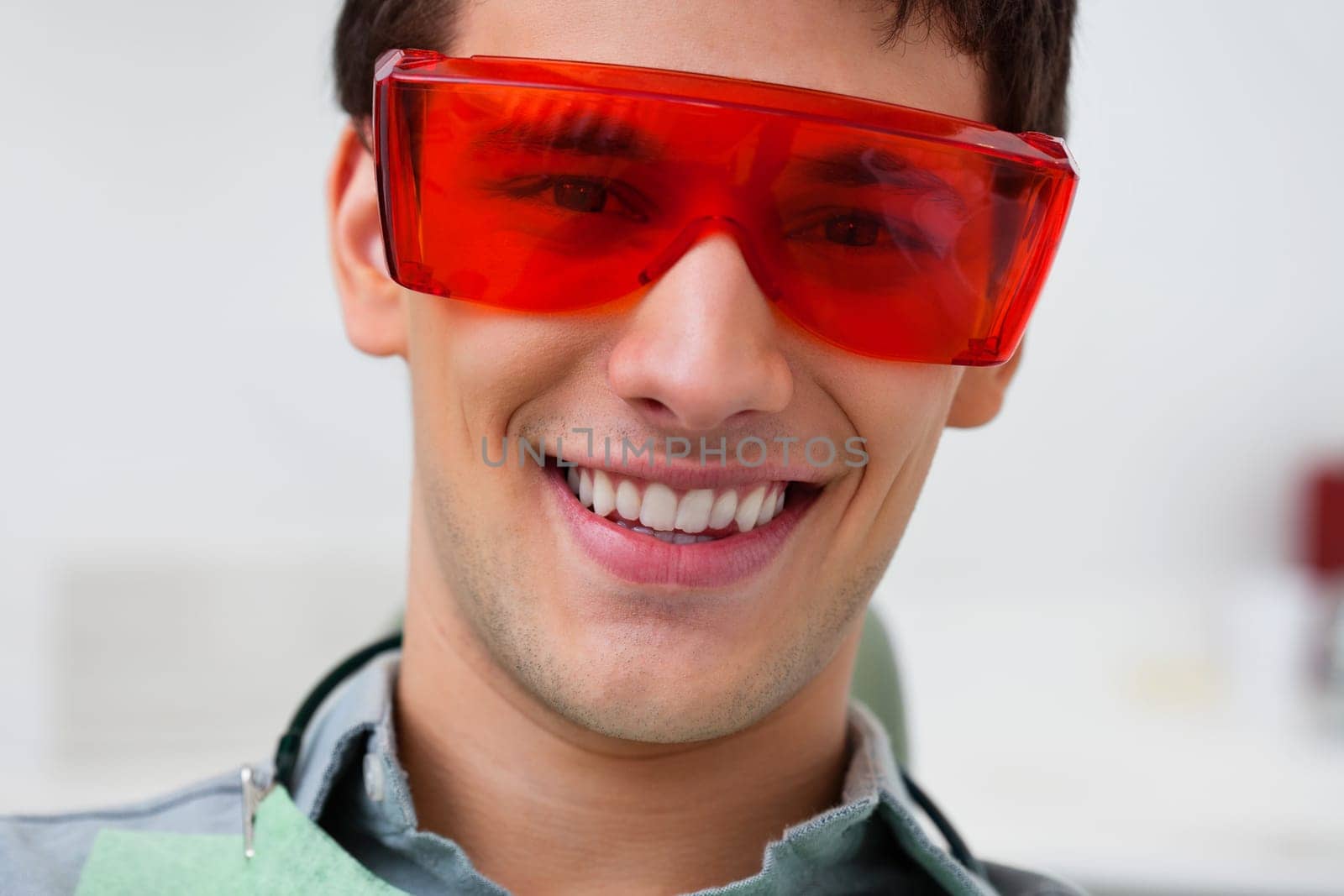 Portrait of dental patient wearing protective eyewear