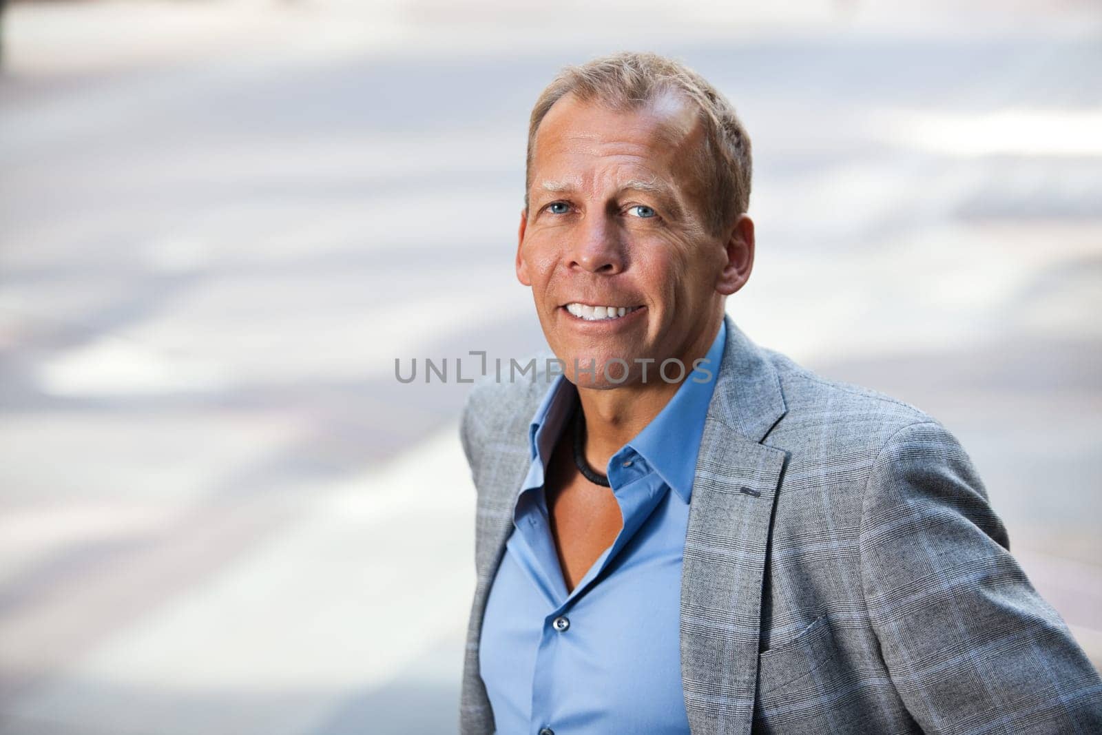 Close-up portrait of smiling businessman