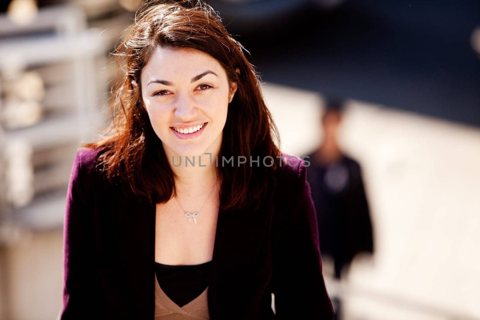 A candid portrait of a young woman in the city