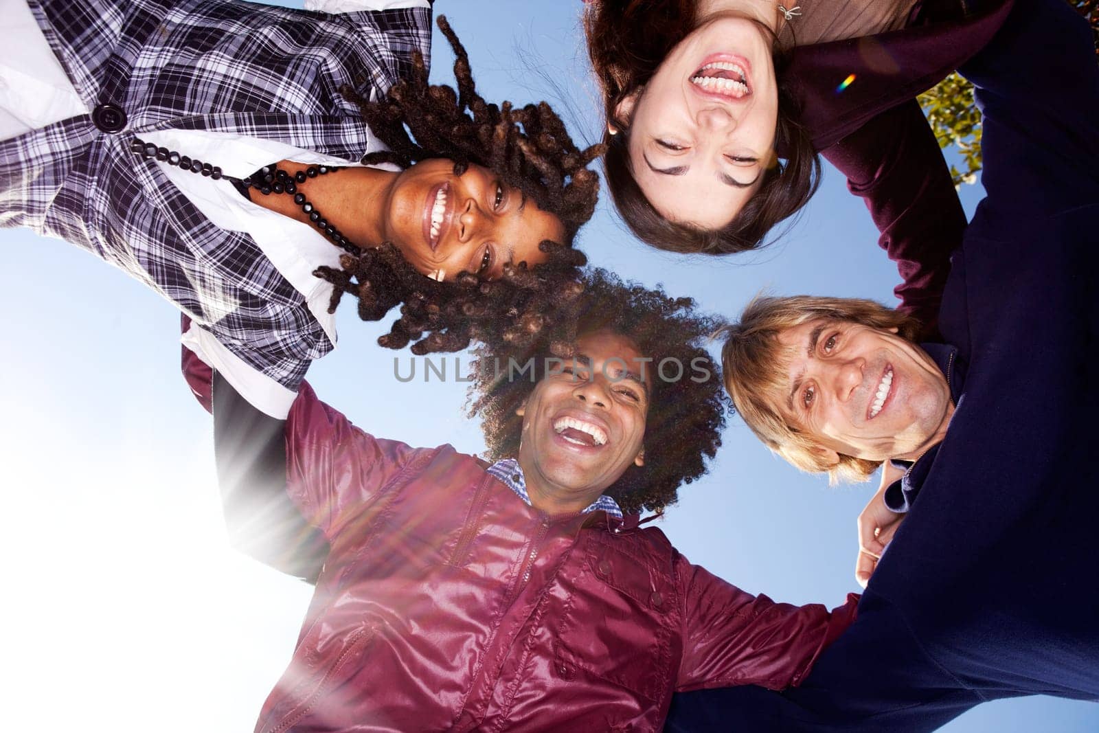 A happy group hug of friends - with solar flare from bottom left