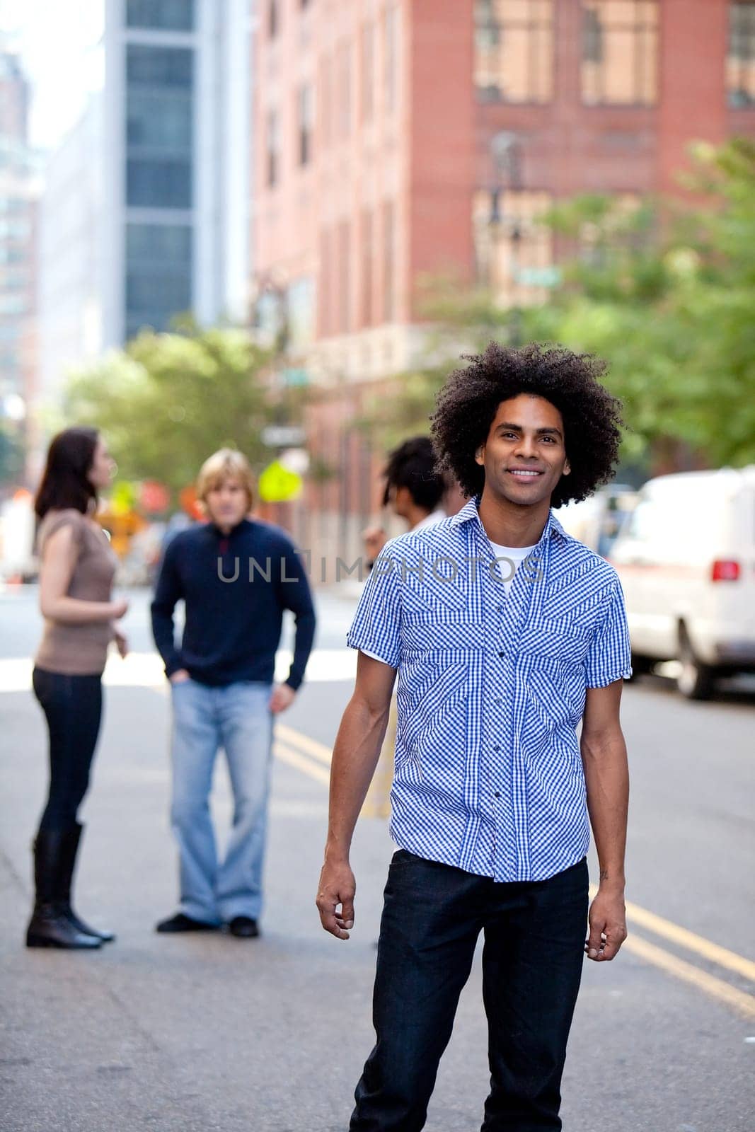 A young adult in a city setting with friends