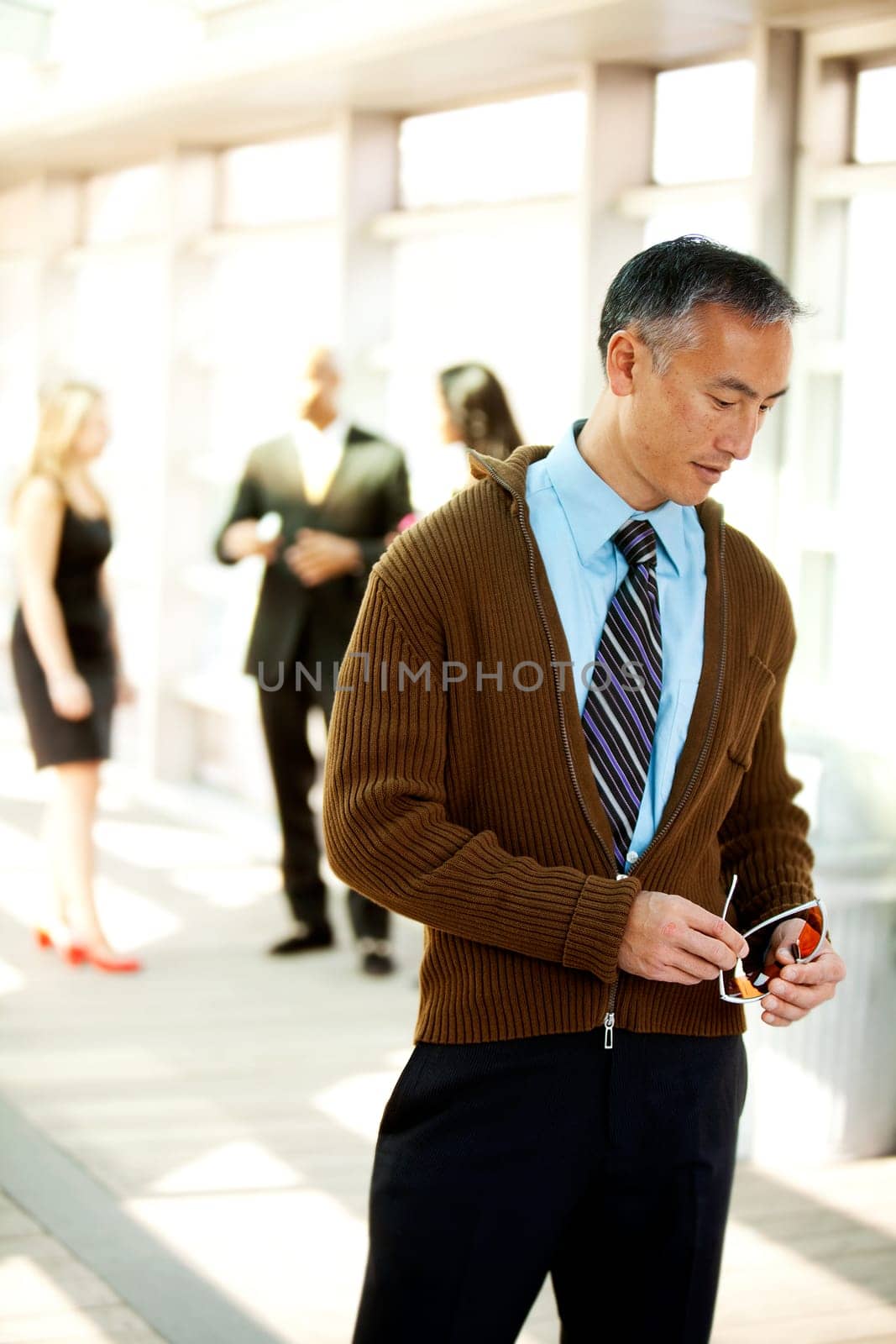 A candid portrait of a business man dressed semi-casual