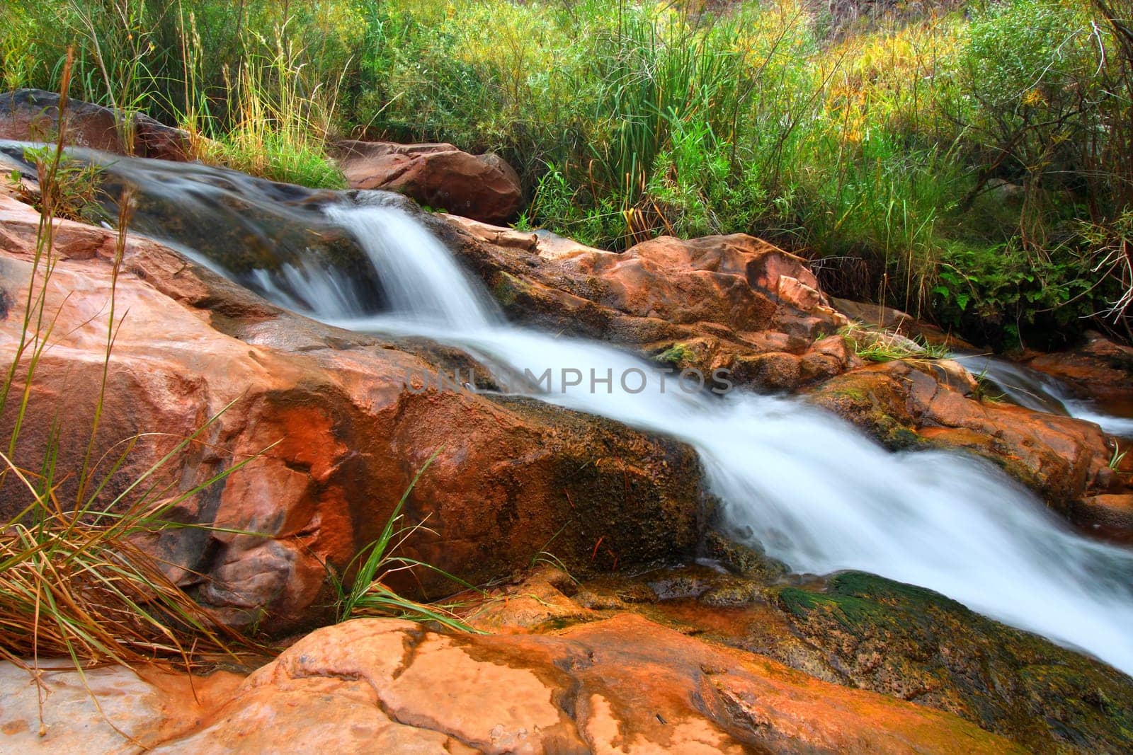 Cascades of a small stream flowing through Grand Canyon National Park on its way to the Colorado River.