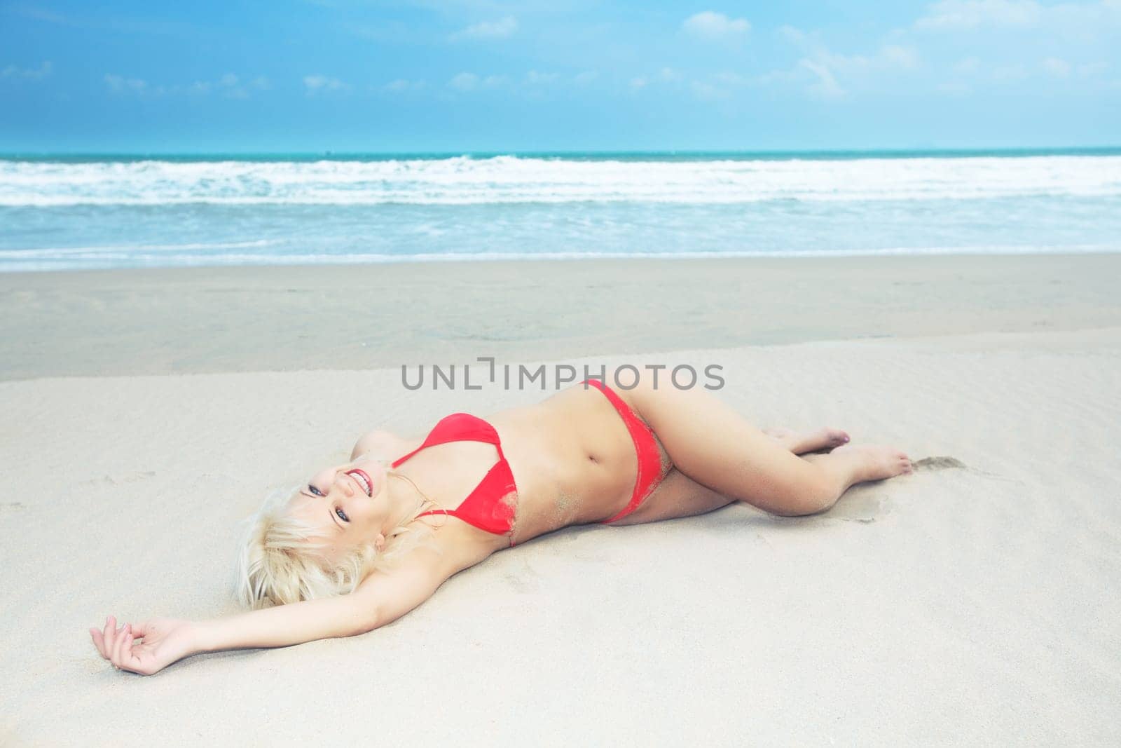Young woman in bikini at the tropical beach
