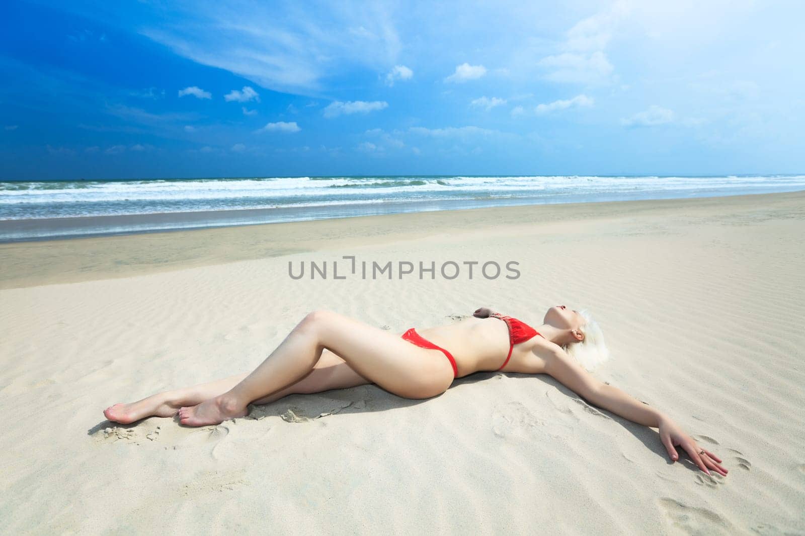 Young woman in bikini at the tropical beach