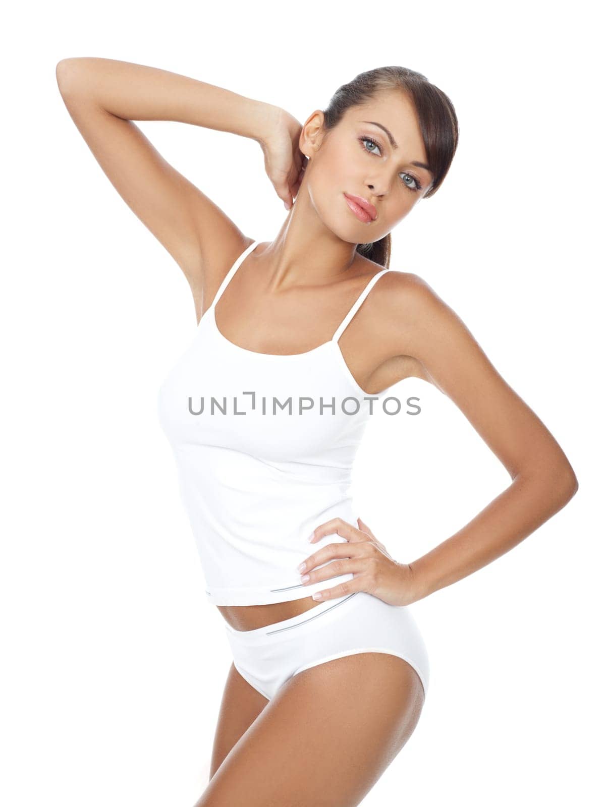 Young beautiful woman in white fitness clothing