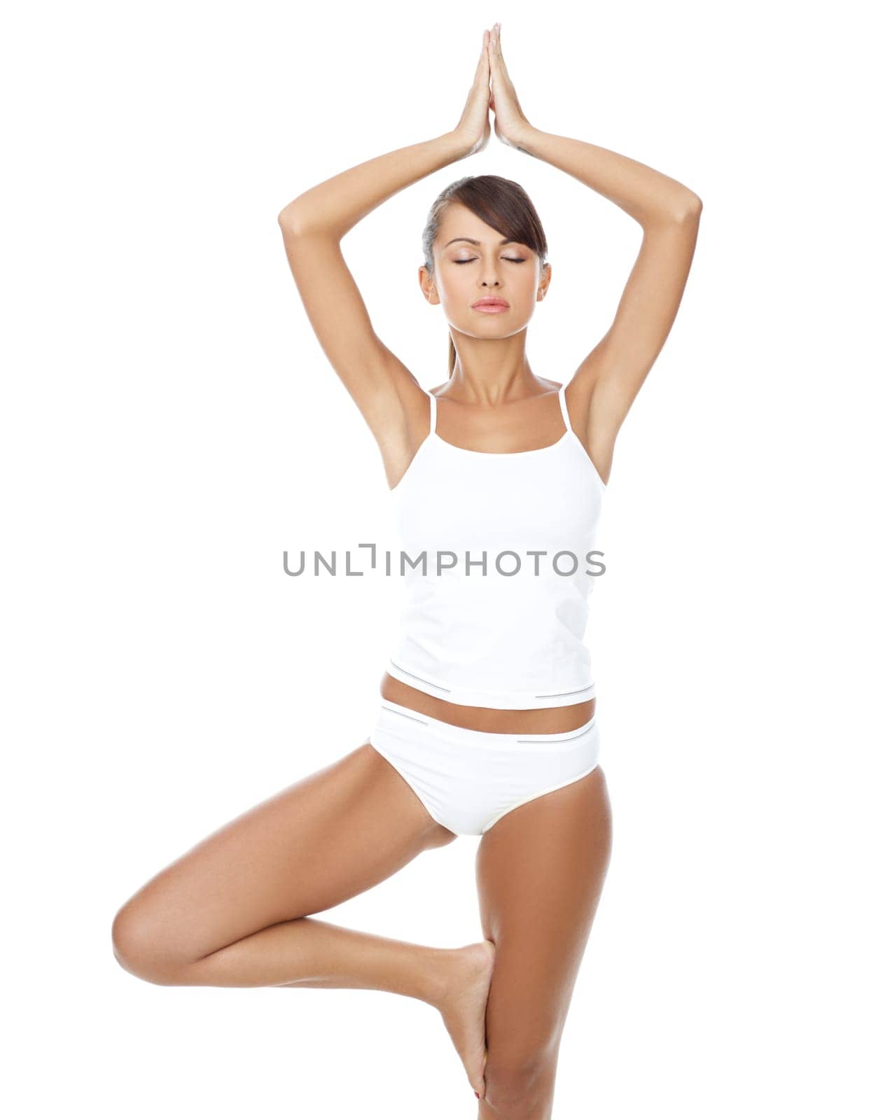 Young beautiful woman in yoga position on white