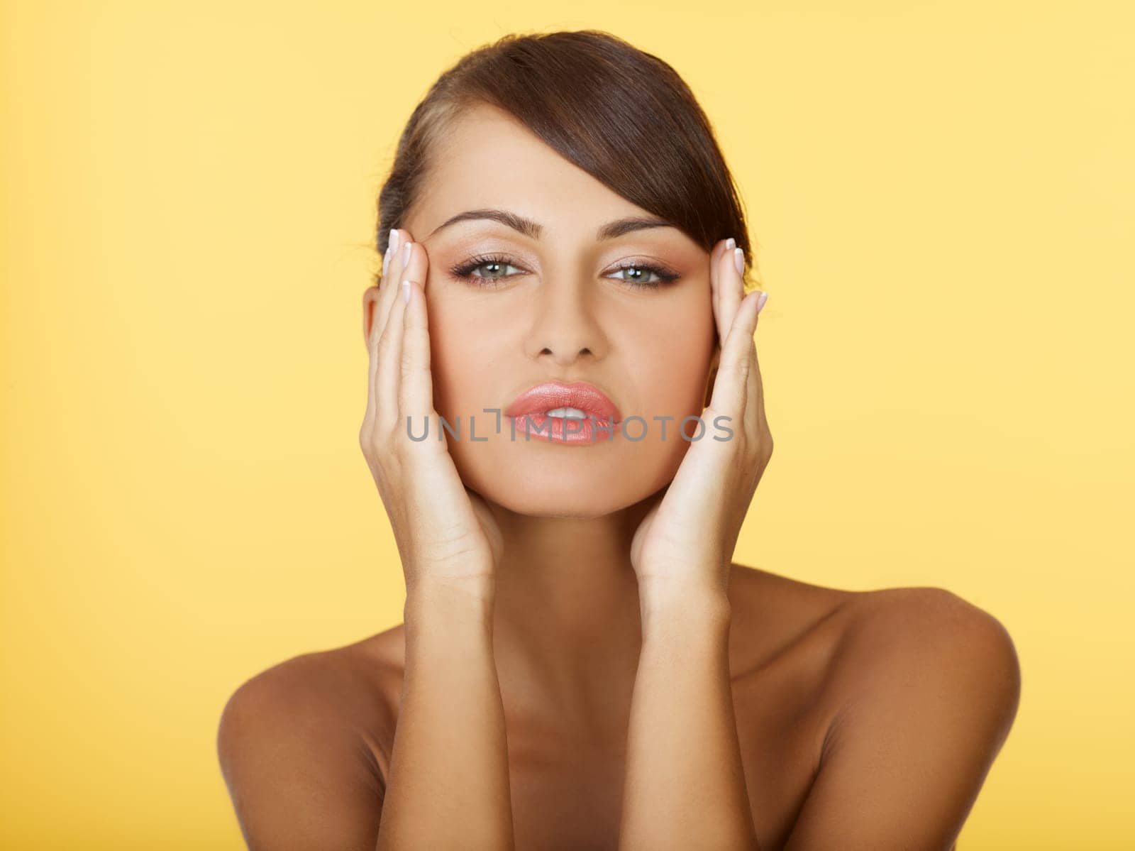 Portrait of beautiful and sexy woman on yellow