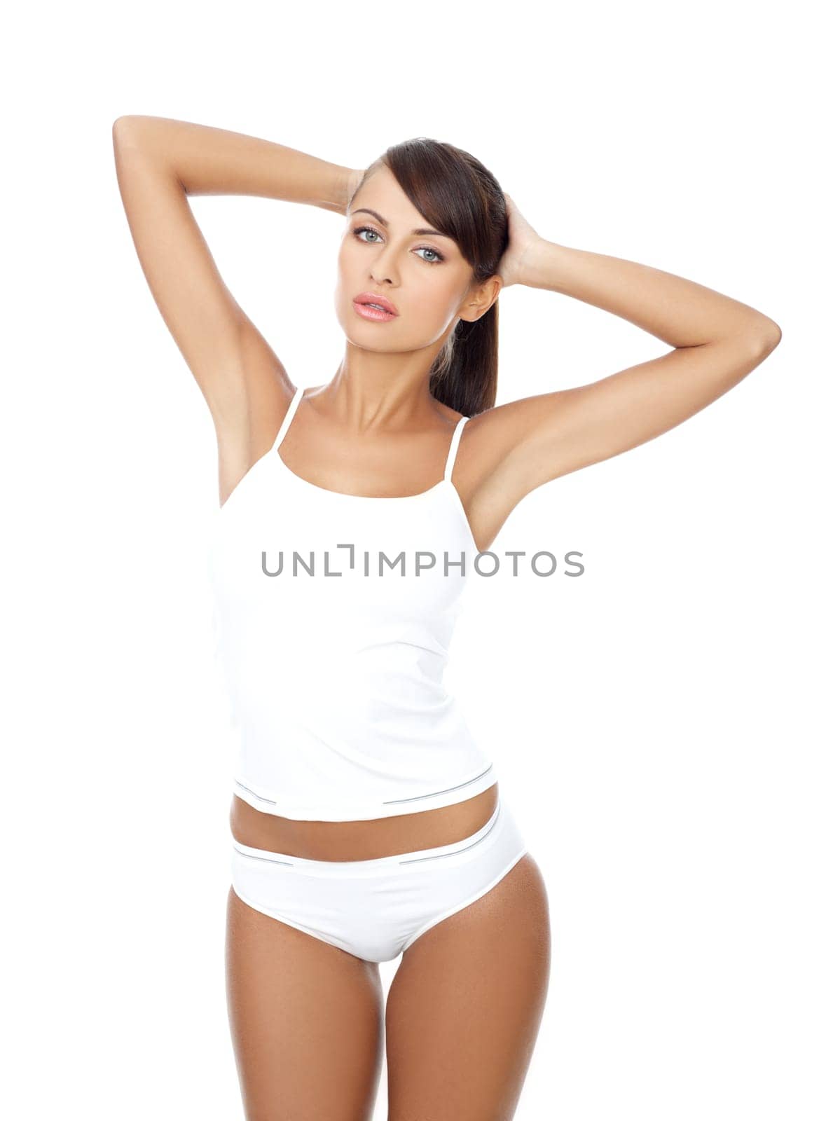 Young beautiful woman in white fitness clothing
