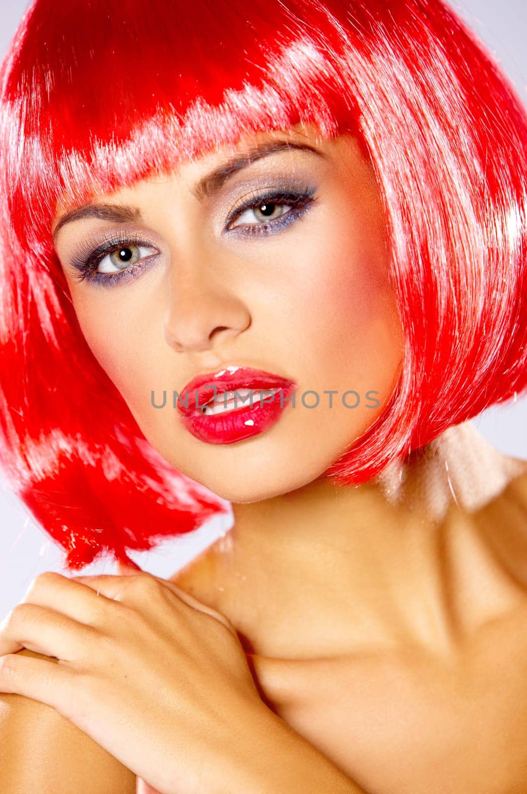 Portrait of beautiful sexy woman in red wig