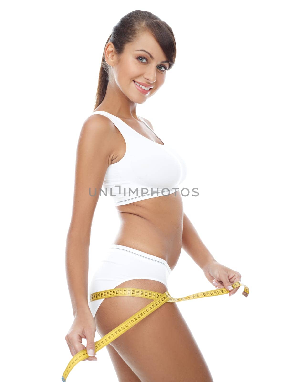 Young beautiful woman with measure tape on white